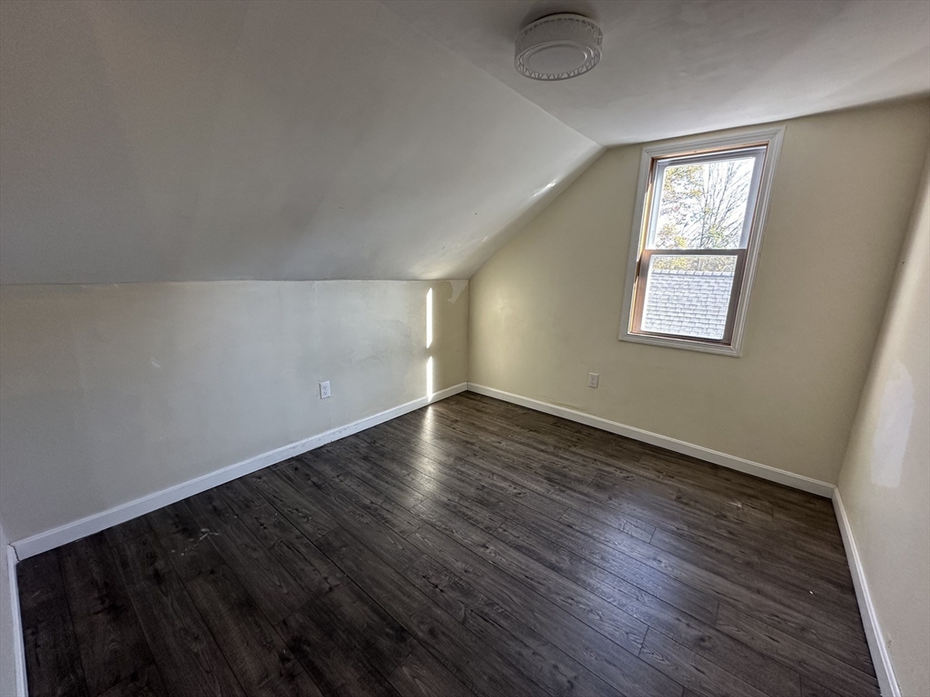 8 Pike Street Hopkinton, MA 01748 - Photo 29 of 34 an empty room with wooden floor and windows