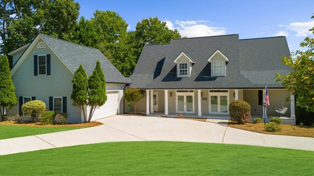 a front view of house with yard and green space