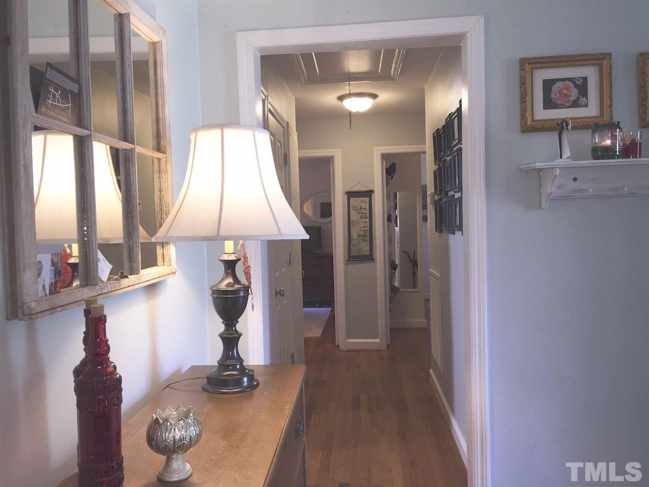 412 Colleton Road Raleigh, NC 27610 - Photo 11 of 19 a view of entryway and hall with wooden floor