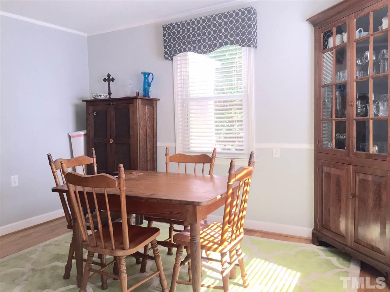 412 Colleton Road Raleigh, NC 27610 - Photo 12 of 19 a view of a dining room with furniture