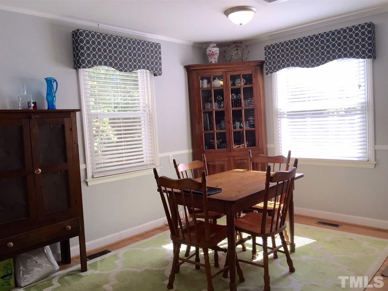 412 Colleton Road Raleigh, NC 27610 - Photo 9 of 19 a view of a dining room with furniture and window