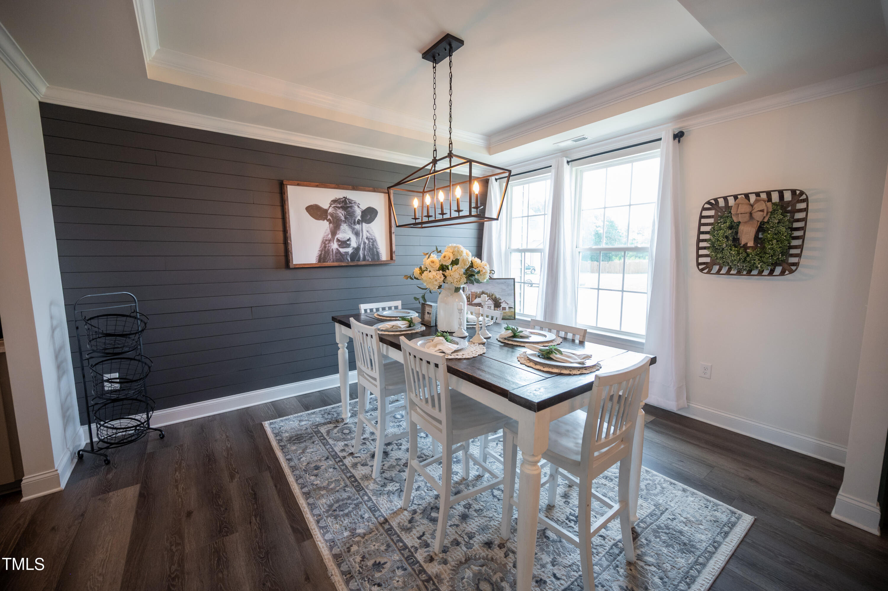 357 Sunrise Ridge Drive Willow Spring, NC 27592 - Photo 11 of 35 a view of a dining room with furniture window and wooden floor