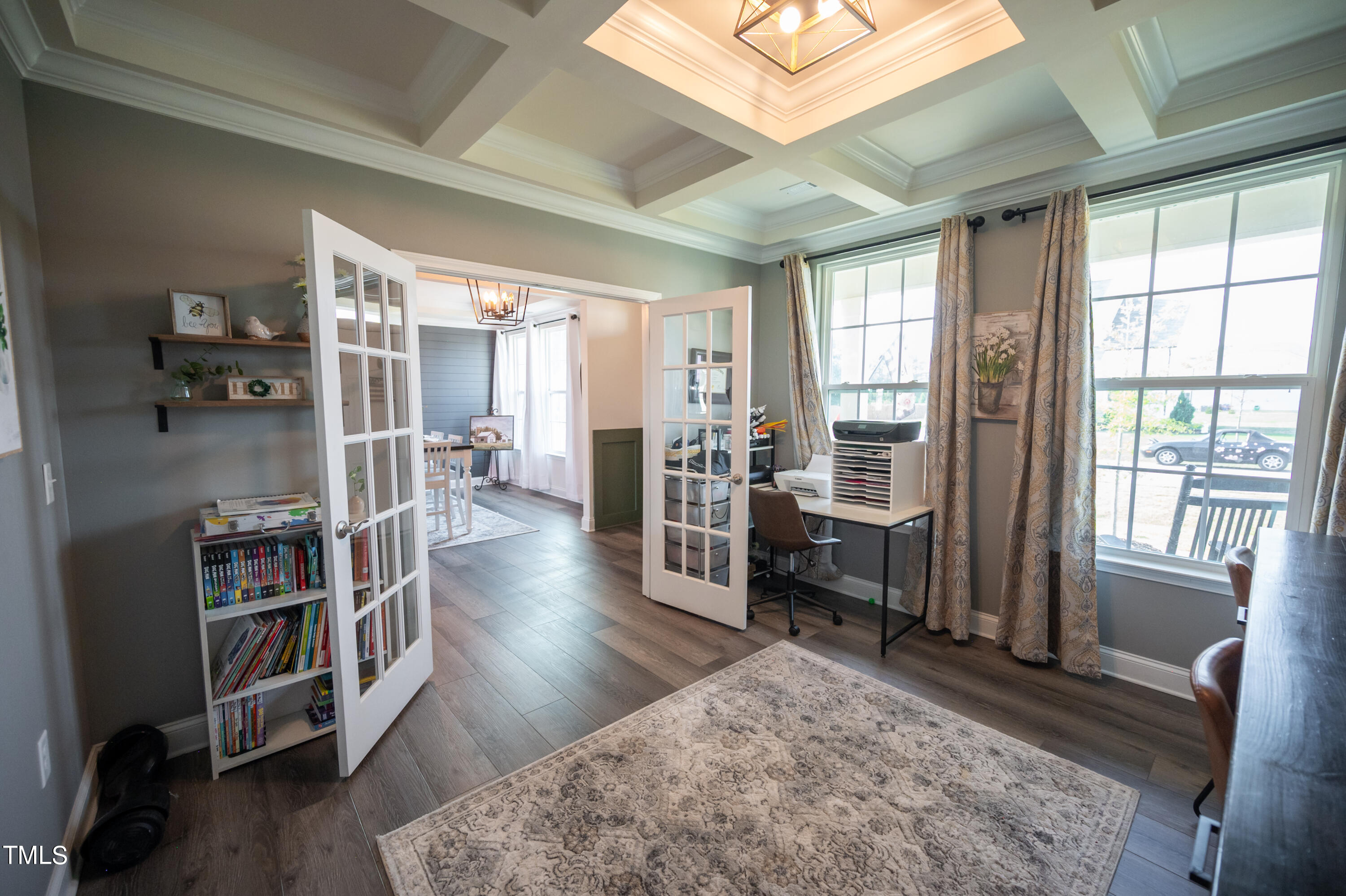 357 Sunrise Ridge Drive Willow Spring, NC 27592 - Photo 16 of 35 a living room with furniture a rug wooden floor and a large window