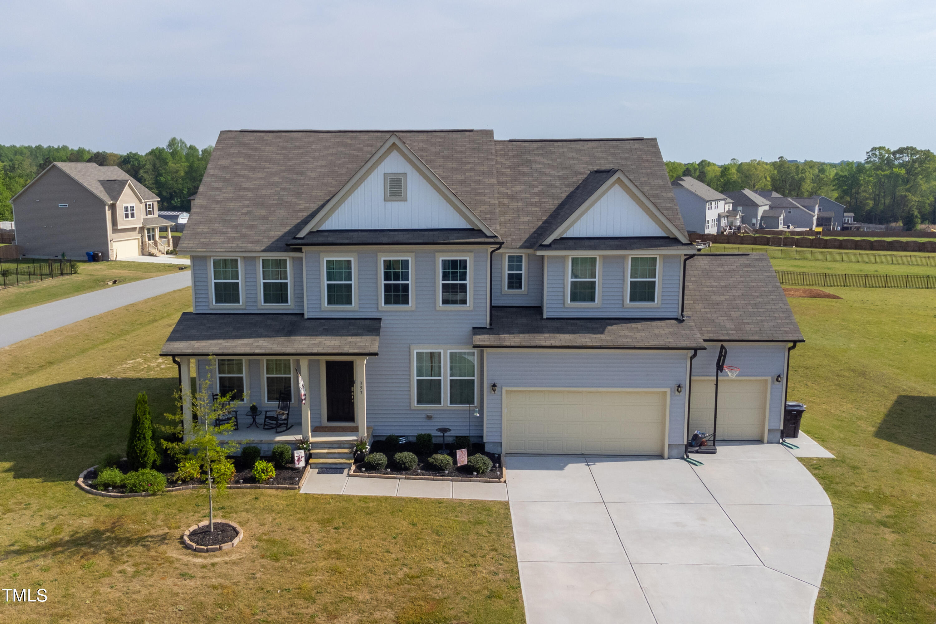 357 Sunrise Ridge Drive Willow Spring, NC 27592 - Photo 2 of 35 front view of a house with a yard