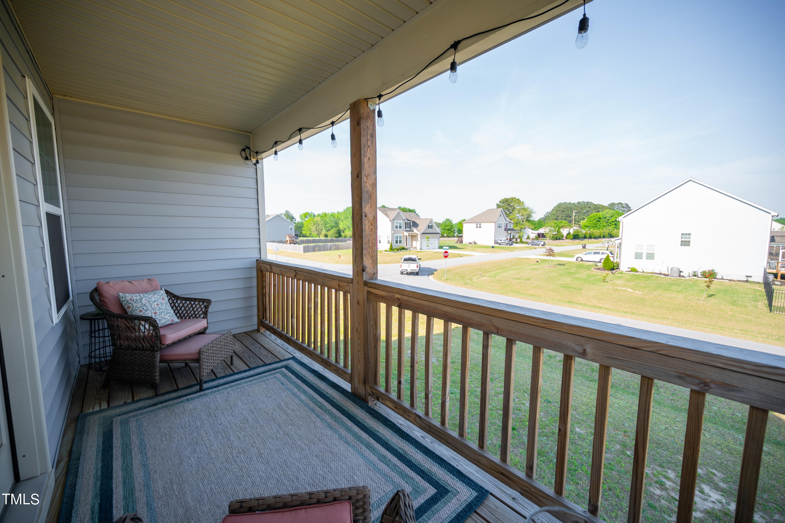 357 Sunrise Ridge Drive Willow Spring, NC 27592 - Photo 24 of 35 a view of a two chair in the balcony