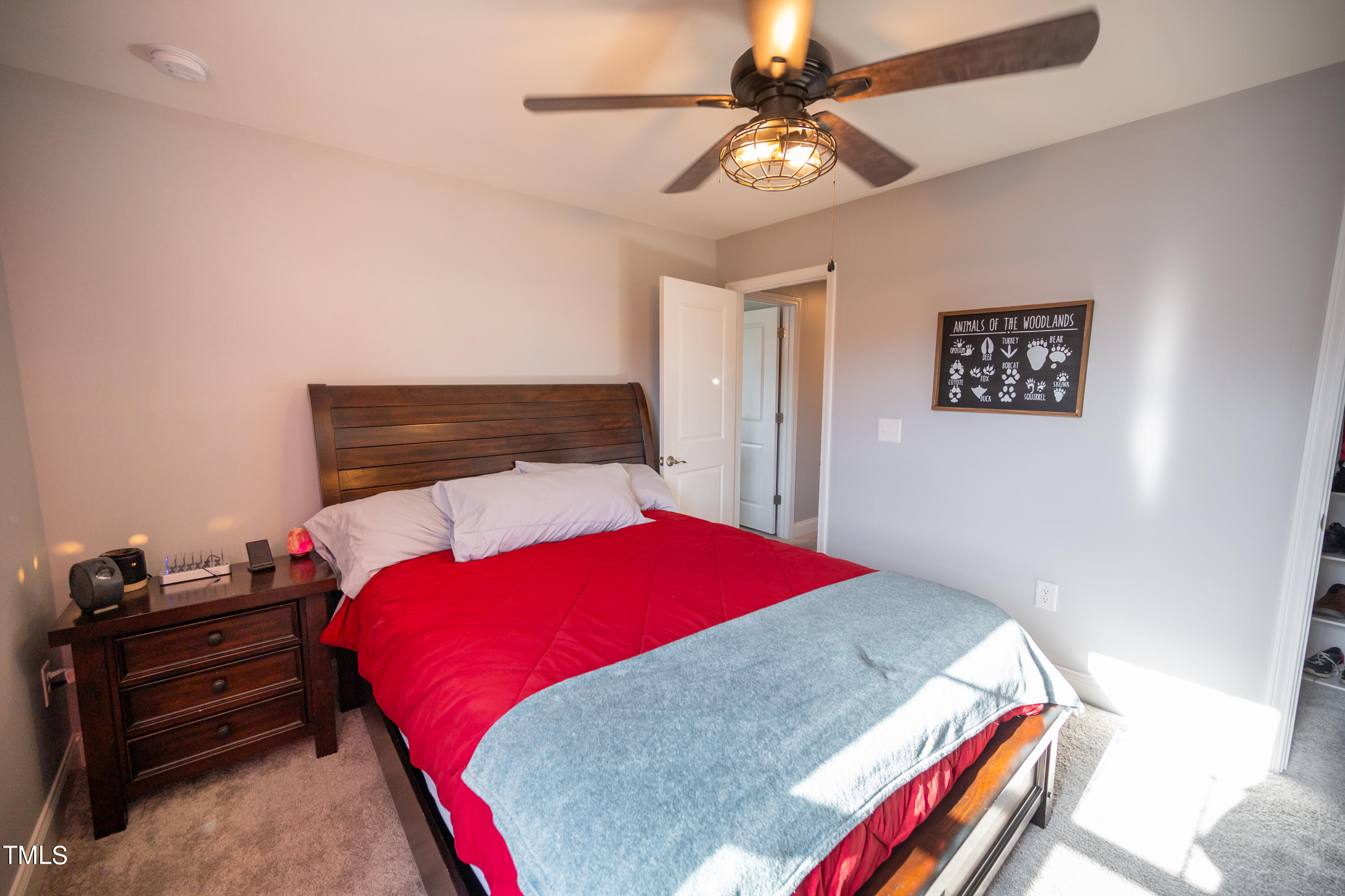 357 Sunrise Ridge Drive Willow Spring, NC 27592 - Photo 28 of 35 a bedroom with a bed and a dresser