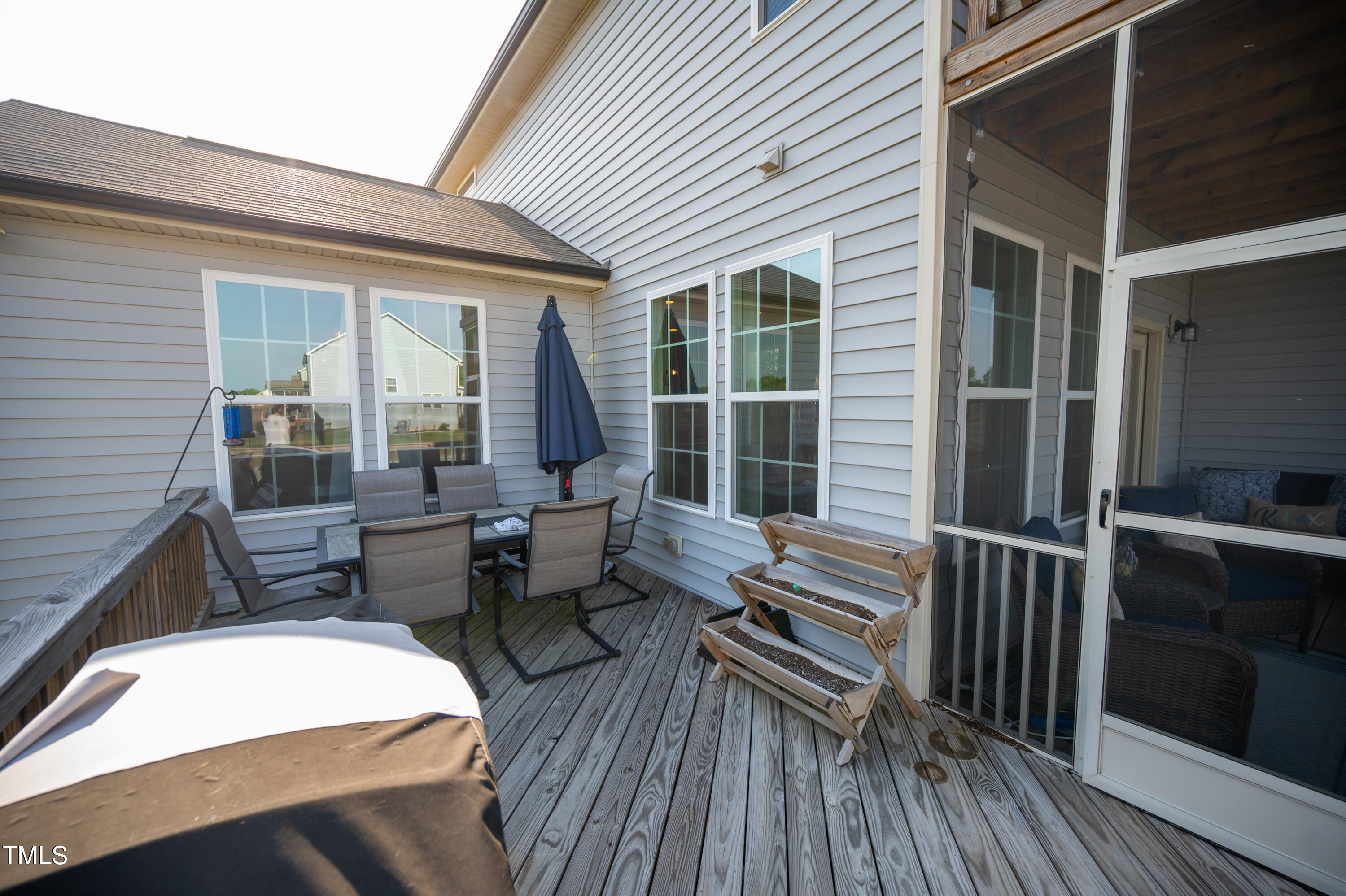 357 Sunrise Ridge Drive Willow Spring, NC 27592 - Photo 33 of 35 a balcony with furniture and wooden floor