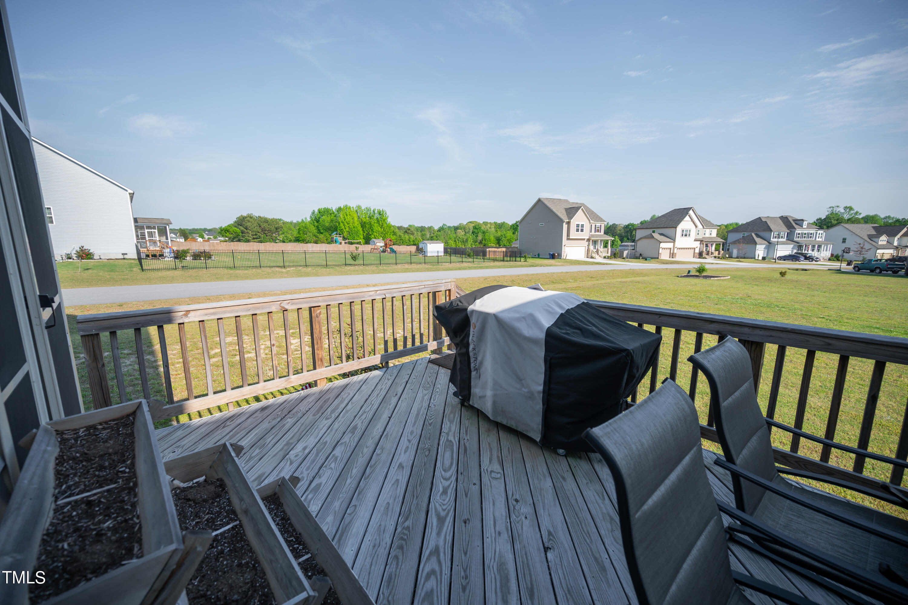 357 Sunrise Ridge Drive Willow Spring, NC 27592 - Photo 34 of 35 a view of balcony with furniture and hardwood