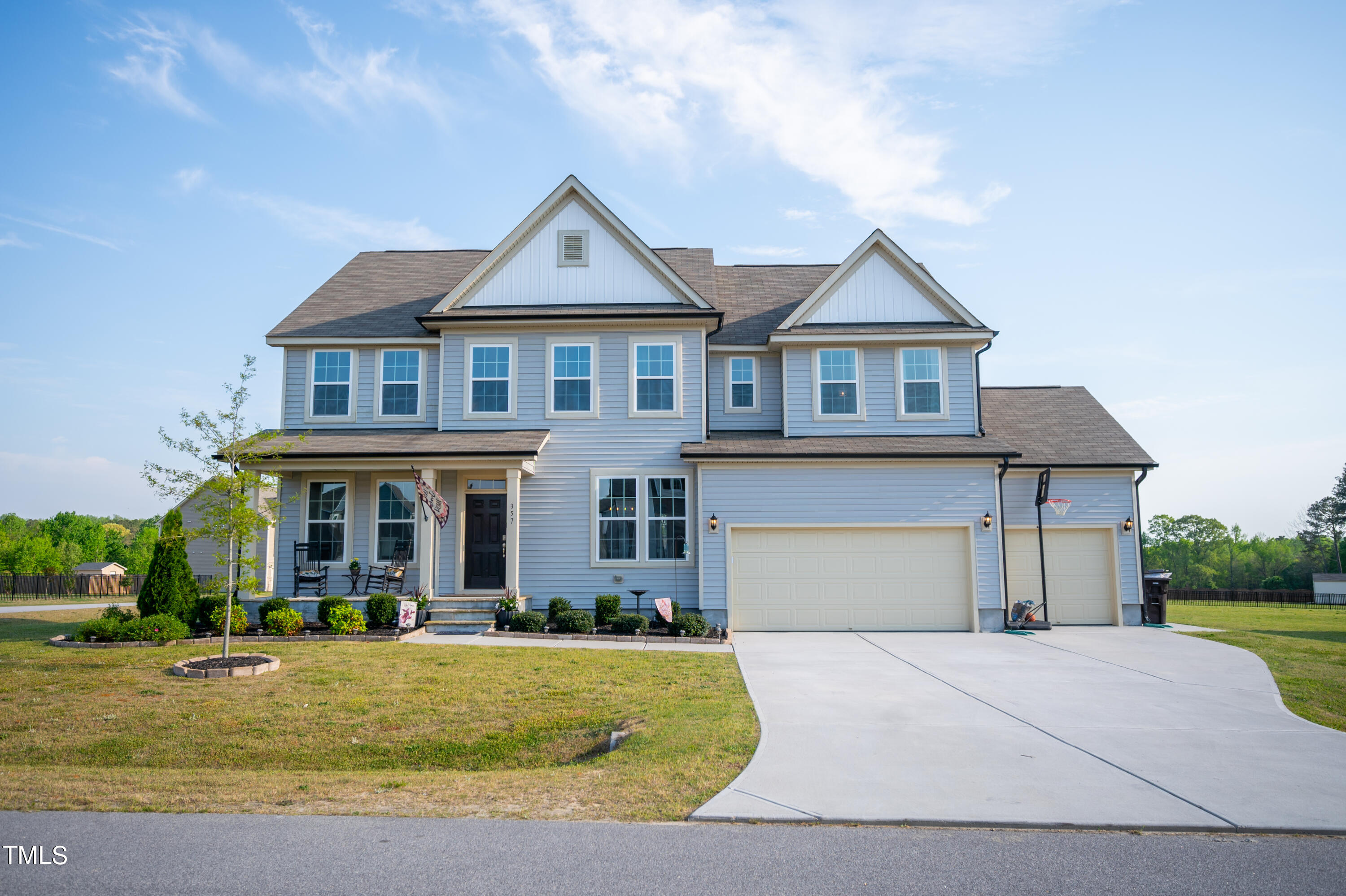 357 Sunrise Ridge Drive Willow Spring, NC 27592 - Photo 35 of 35 a front view of a house with garden