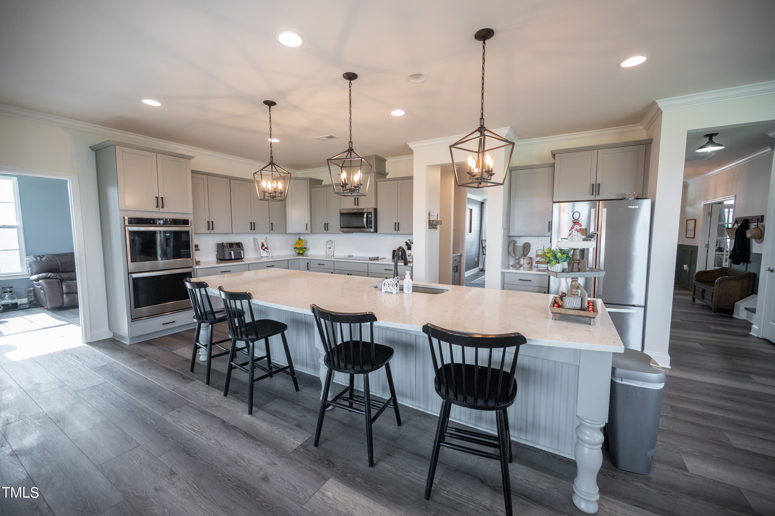 357 Sunrise Ridge Drive Willow Spring, NC 27592 - Photo 7 of 35 a dining area with a table chairs and a kitchen view