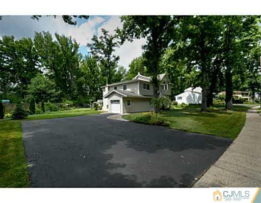 15 Warwick Road Edison, NJ 08820 - Photo 1 of 25 a house view with a garden space