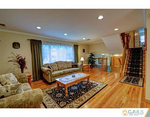 15 Warwick Road Edison, NJ 08820 - Photo 3 of 25 a living room with furniture and wooden floor