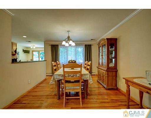 15 Warwick Road Edison, NJ 08820 - Photo 5 of 25 a view of a dining room with furniture and chandelier