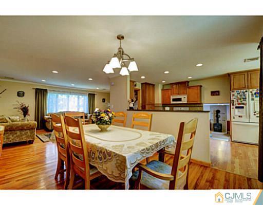 15 Warwick Road Edison, NJ 08820 - Photo 6 of 25 a view of a dining room with furniture and wooden floor