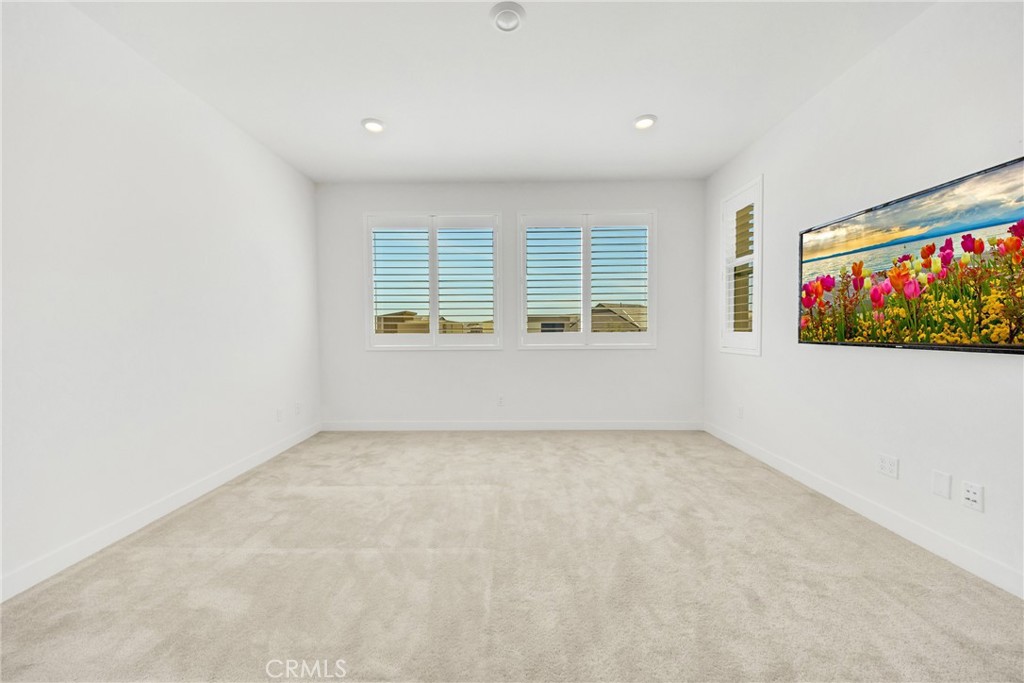 1109 Cadence Irvine, CA 92618 - Photo 8 of 12 an empty room with windows