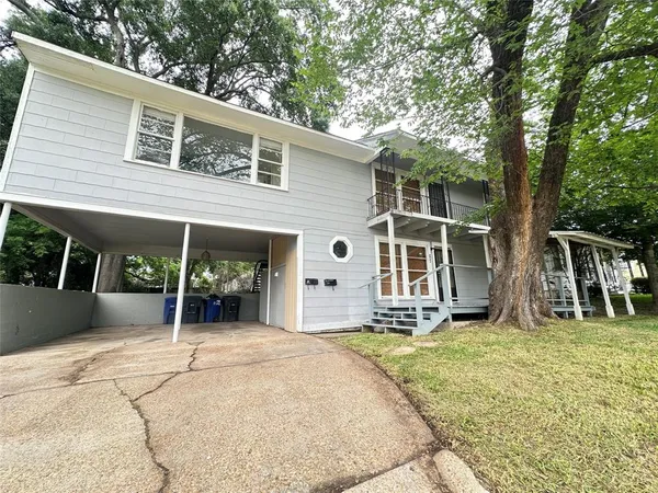 a front view of a house with a patio