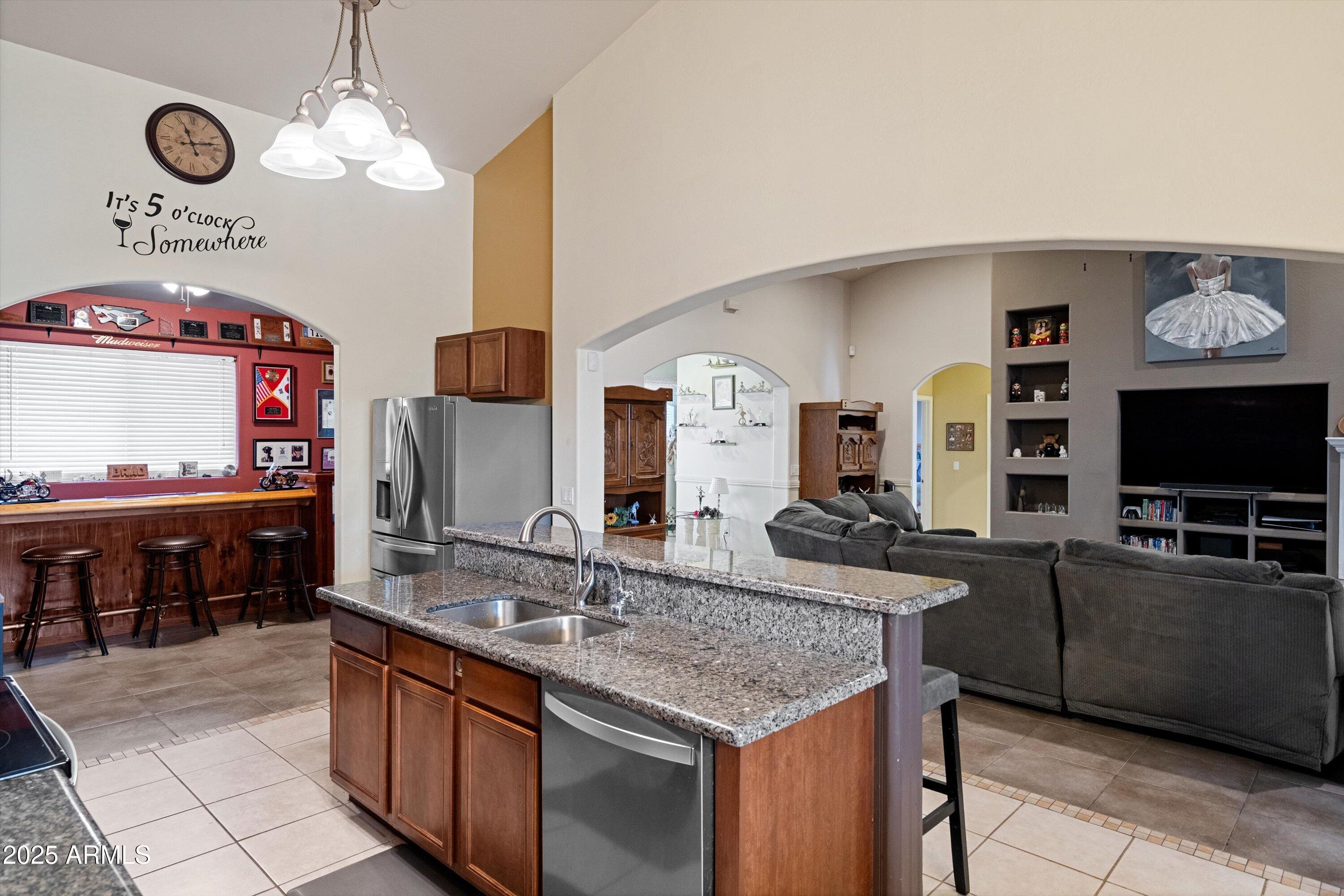 35947 West Buckeye Road Tonopah, AZ 85354 - Photo 14 of 54 a kitchen with stainless steel appliances granite countertop a sink and a microwave