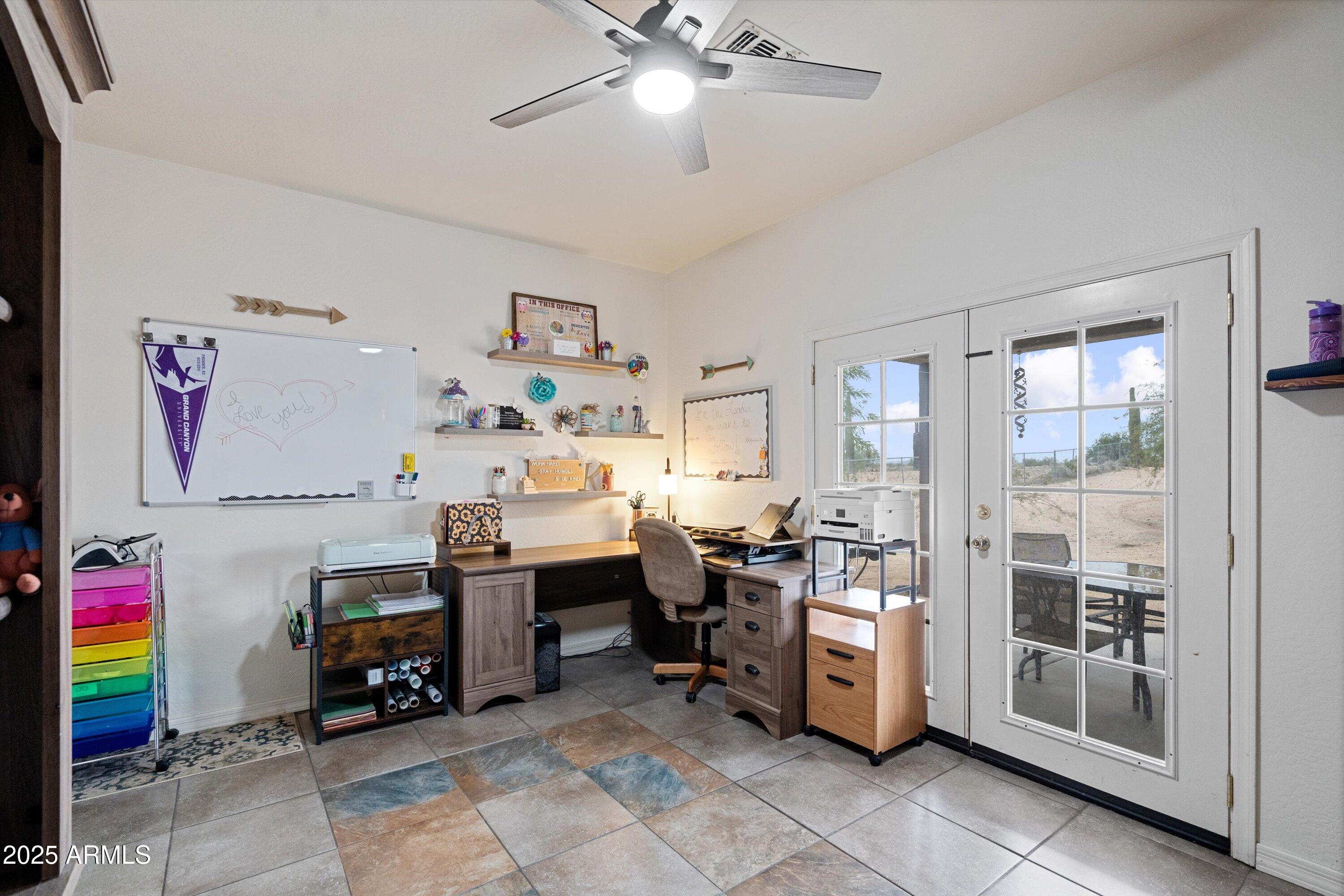 35947 West Buckeye Road Tonopah, AZ 85354 - Photo 32 of 54 a room with furniture a flat screen tv and a window