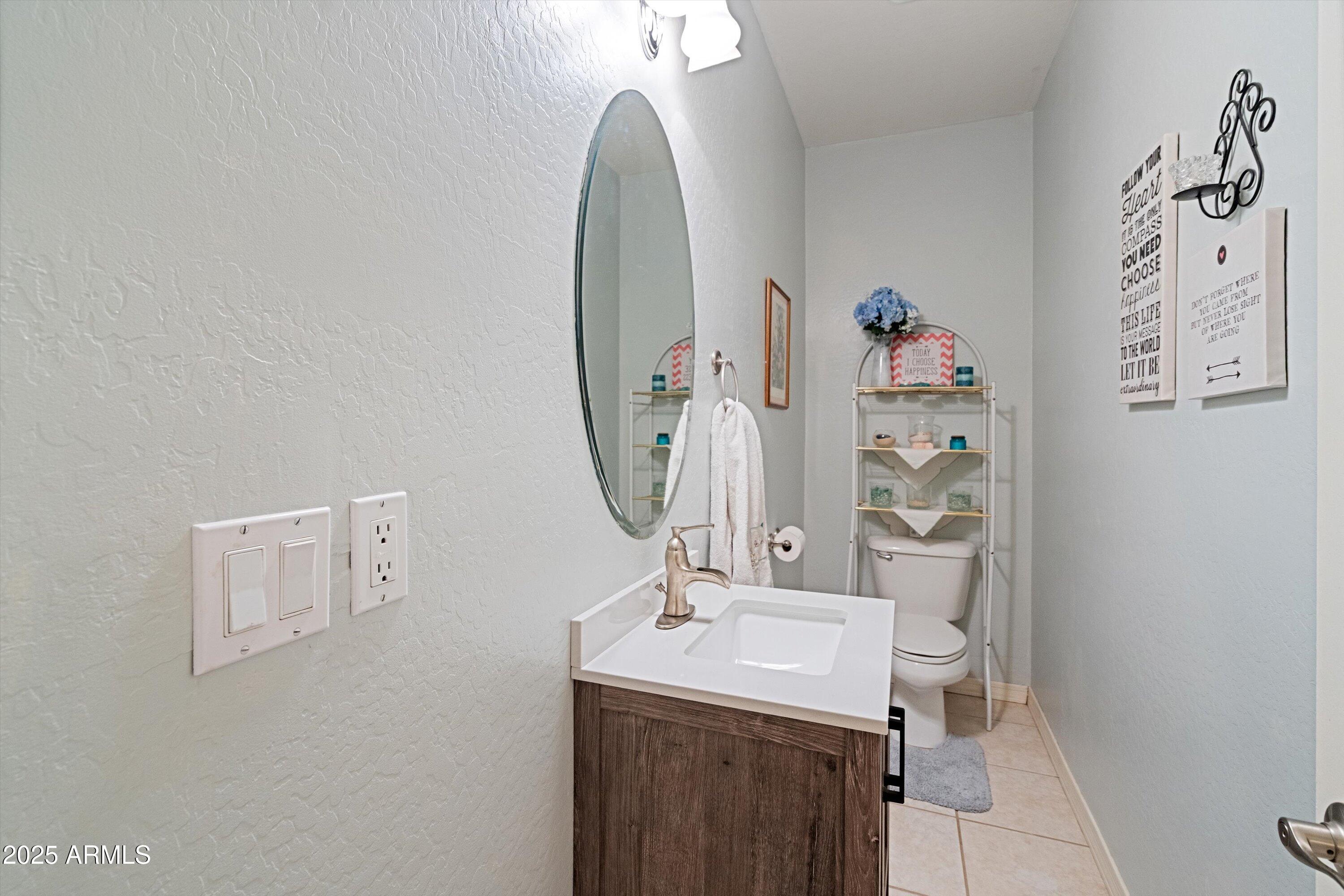 35947 West Buckeye Road Tonopah, AZ 85354 - Photo 33 of 54 a bathroom with a sink mirror and toilet