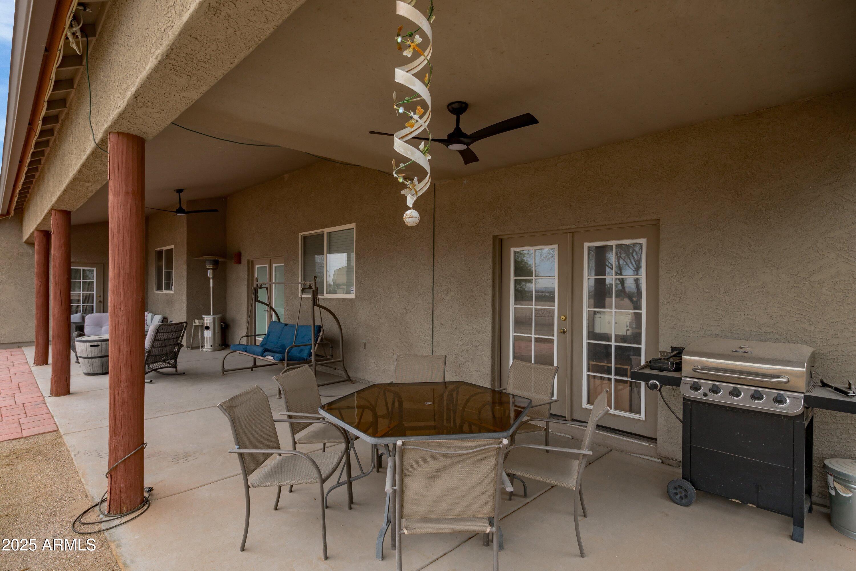 35947 West Buckeye Road Tonopah, AZ 85354 - Photo 35 of 54 a dining room with furniture and a chandelier