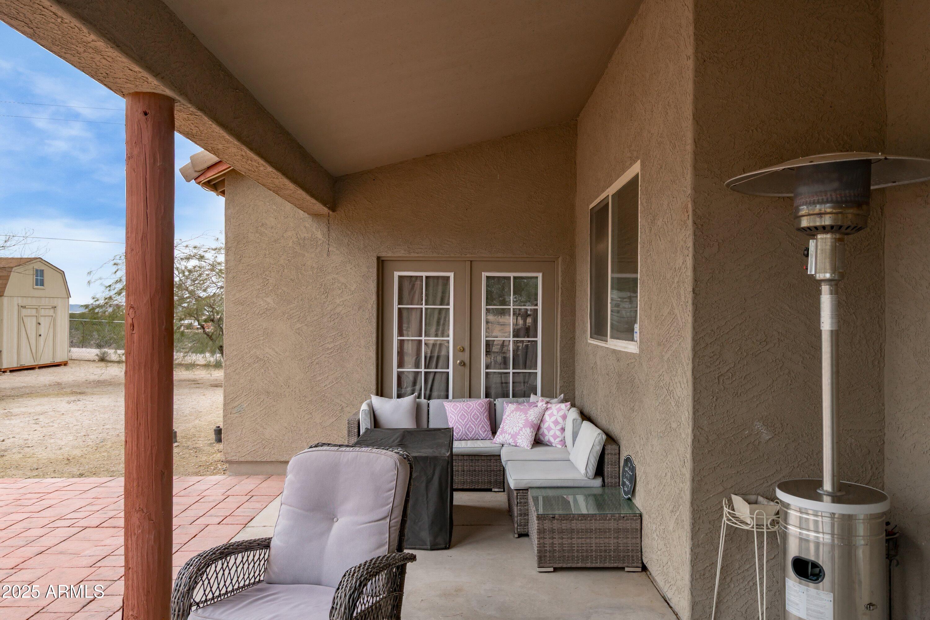 35947 West Buckeye Road Tonopah, AZ 85354 - Photo 38 of 54 a balcony with furniture and some potted plants