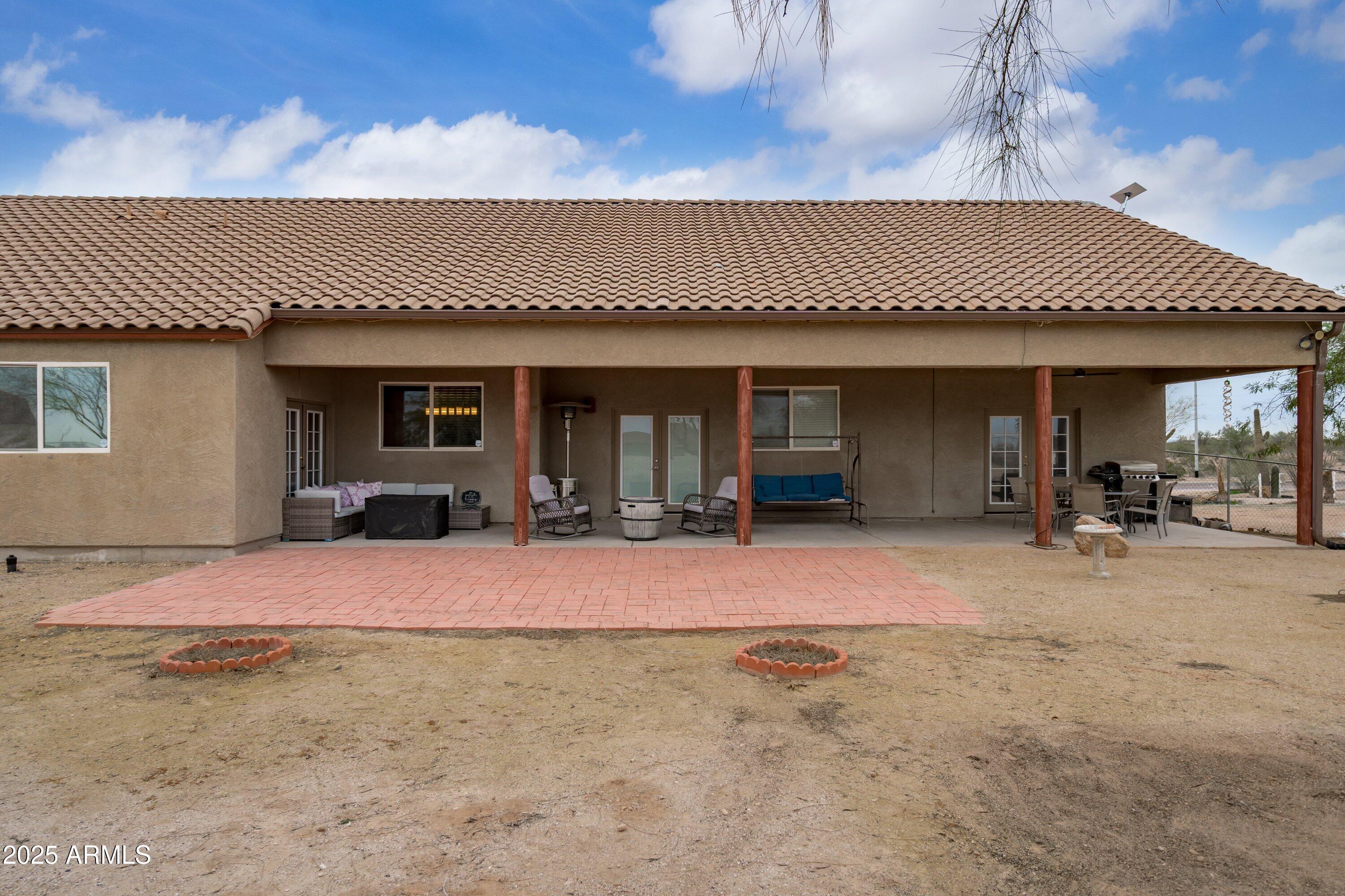 35947 West Buckeye Road Tonopah, AZ 85354 - Photo 41 of 54 a view of a house with backyard and porch