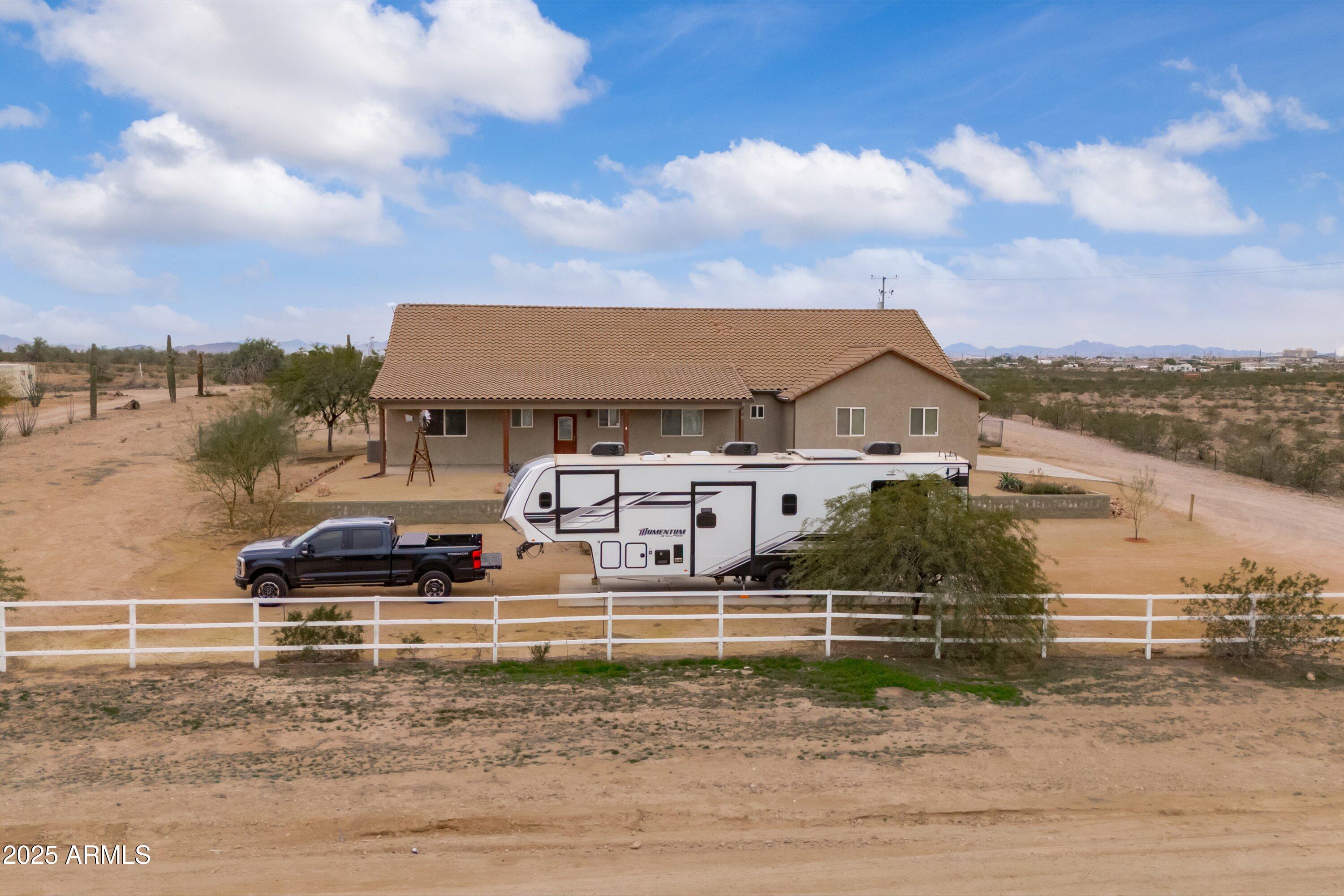 35947 West Buckeye Road Tonopah, AZ 85354 - Photo 47 of 54 a front view of a house with a yard