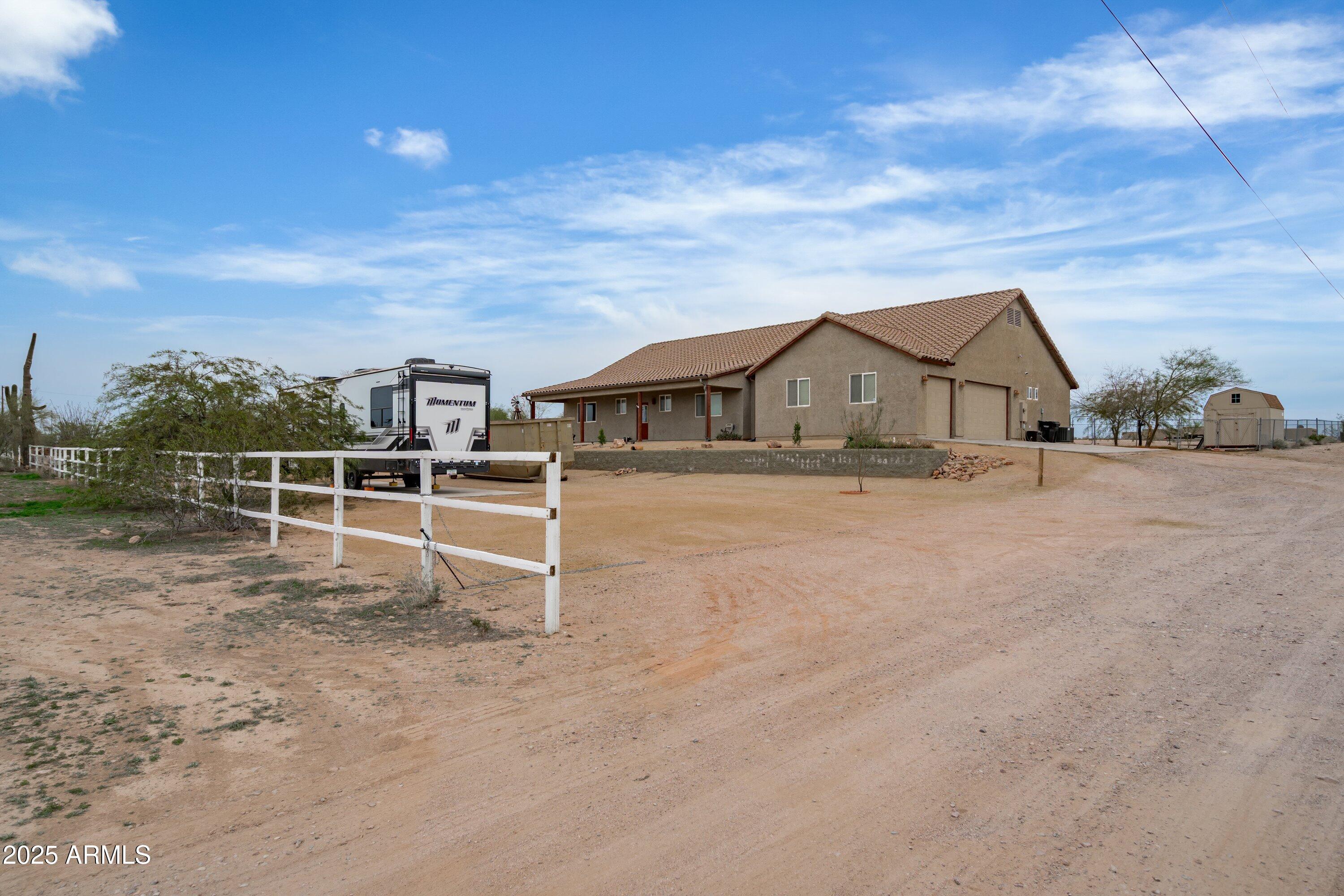 35947 West Buckeye Road Tonopah, AZ 85354 - Photo 6 of 54 a view of a house with a yard