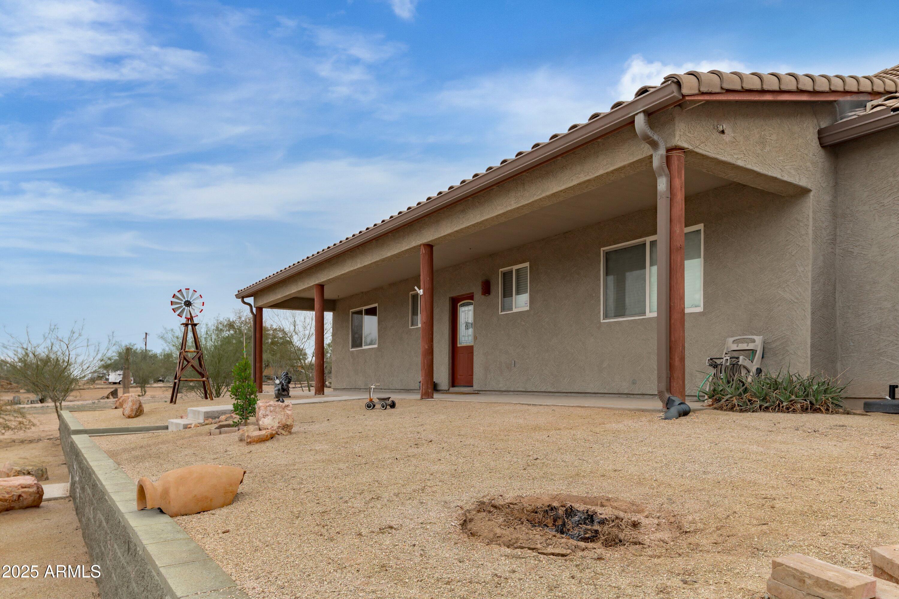 35947 West Buckeye Road Tonopah, AZ 85354 - Photo 8 of 54 a view of a house with backyard and snow