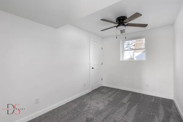 a view of empty room with windows