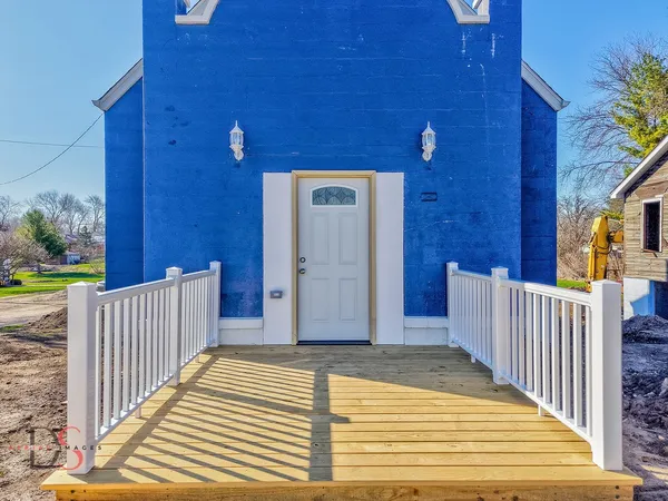 a view of a wooden door of the house