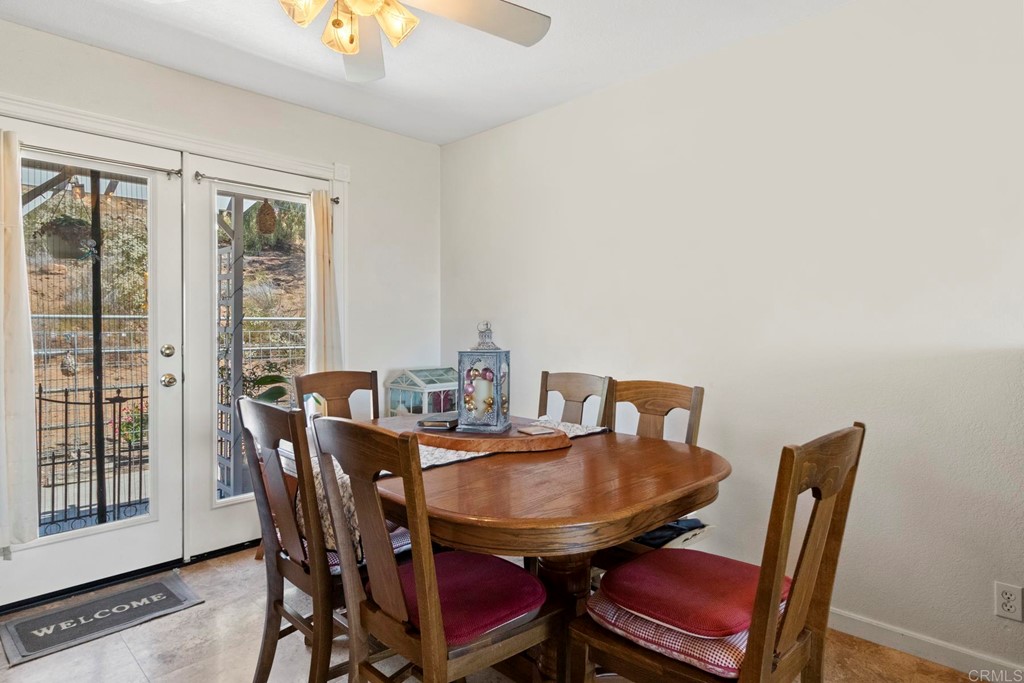 1104 Doomey Drive Ramona, CA 92065 - Photo 12 of 31 a view of a dining room with furniture and wooden floor