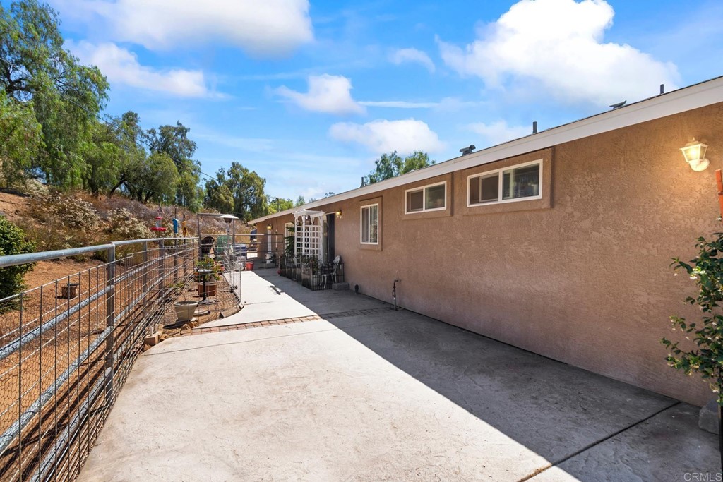 1104 Doomey Drive Ramona, CA 92065 - Photo 28 of 31 a view of a house with a backyard