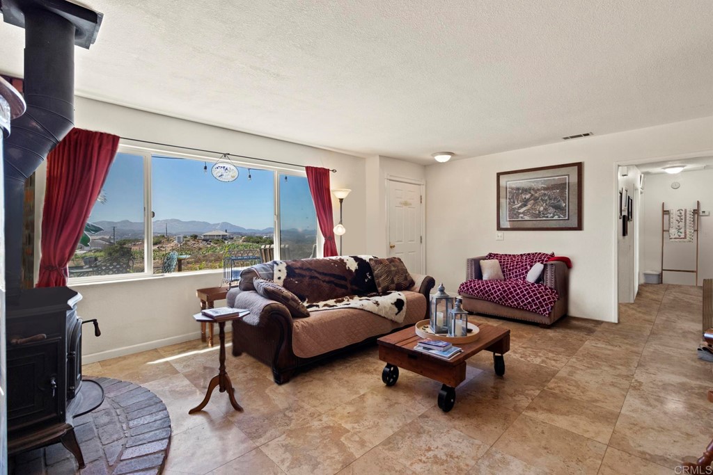 1104 Doomey Drive Ramona, CA 92065 - Photo 6 of 31 a living room with furniture and a large window