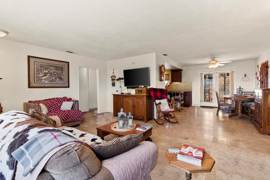 1104 Doomey Drive Ramona, CA 92065 - Photo 10 of 31 a living room with furniture and a flat screen tv
