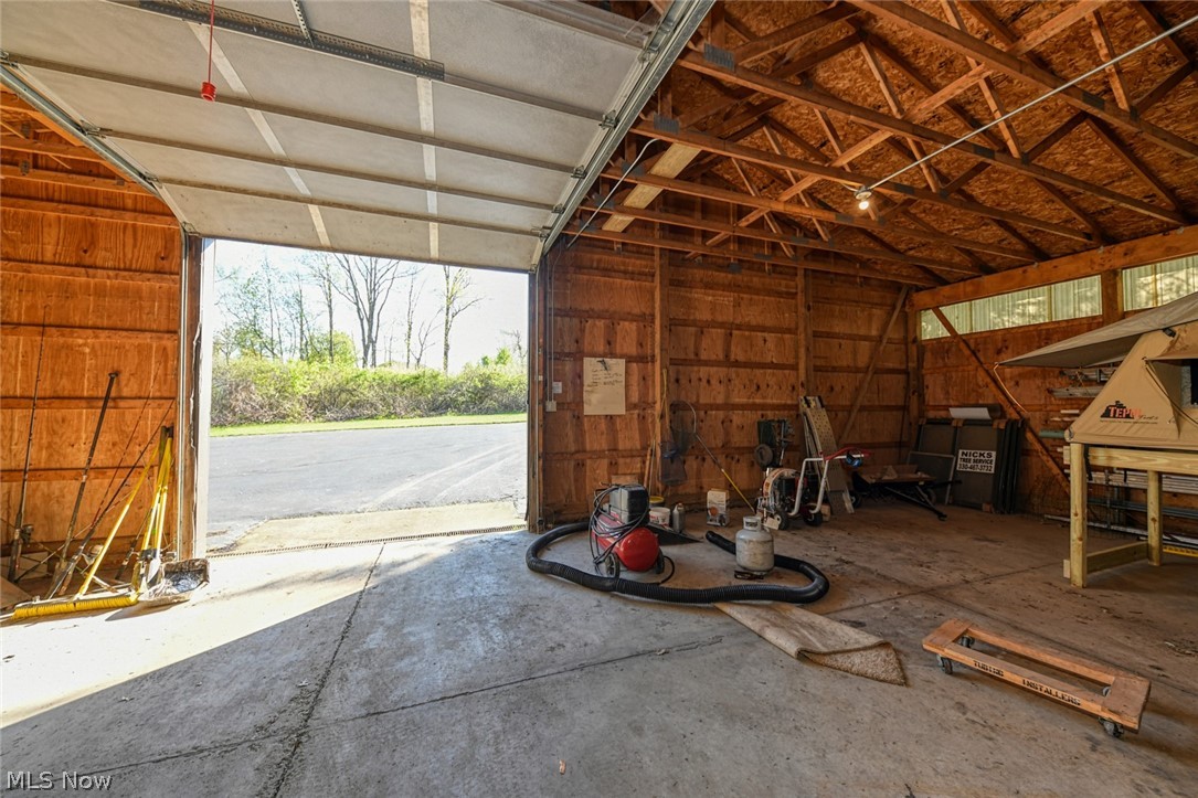 9377 Valley View Road Macedonia, OH 44056 - Photo 8 of 35 9377 Valley View Rd Macedonia OH 44056 GORGEOUS fully remodeled Ranch & 40x72 Barn on 3.5 acres! Huge 30'x28' Cathedral Great Room Wood accents & Fireplace wall open from the Completely Renovated professionally designed Kitchen & multiple seating areas, plenty of granite throughout. This 4 bedroom, 2.5 Bath Ranch boasts a great family layout all on 1 floor w/ Theater/Media Room, Front Cozy Family Room & 2nd Fireplace, Screened Rear Porch, Front Enclosed Entry, Lots of Storage Cabinetry, Laundry Room!