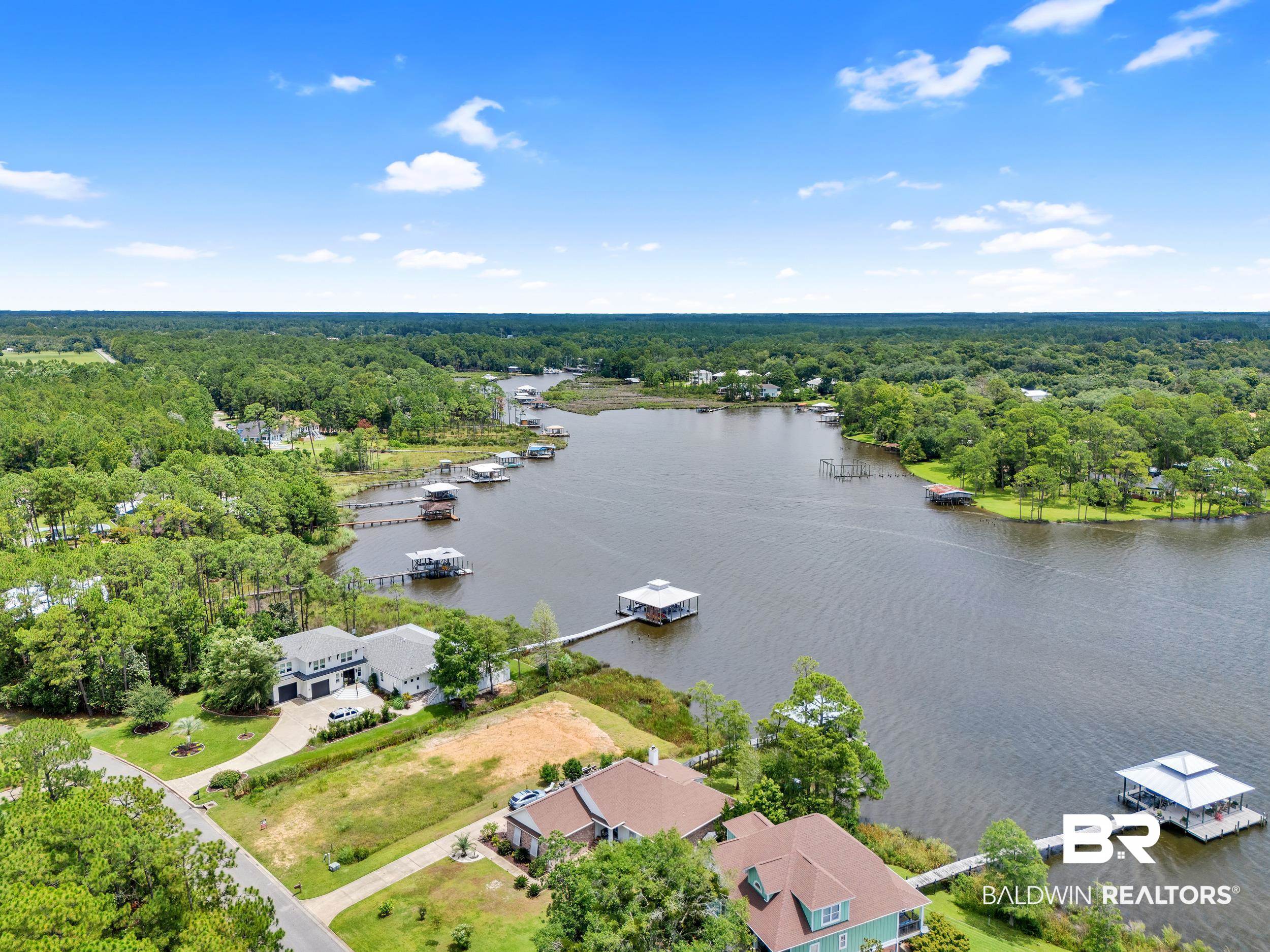 8963 Bay Point Drive Elberta, AL 36530 - Photo 14 of 25 Bird's eye view of a forest and a large body of water