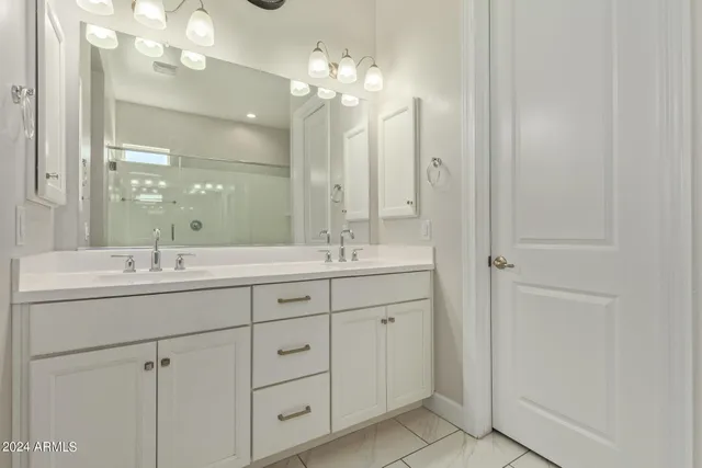 a bedroom with a bed and a walk in closet