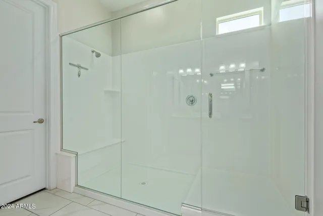 a bathroom with a sink vanity and mirror