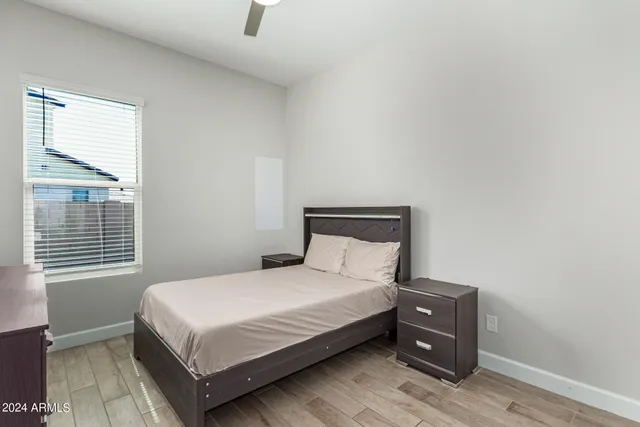 a bedroom with windows