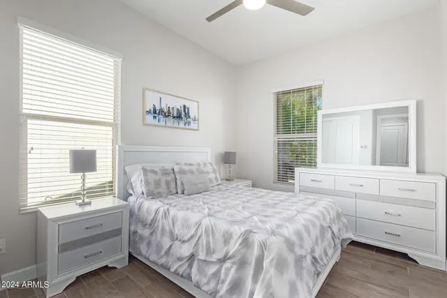 a bedroom with a bed and window