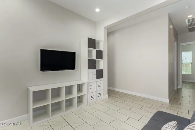 a room with furniture and a flat screen tv