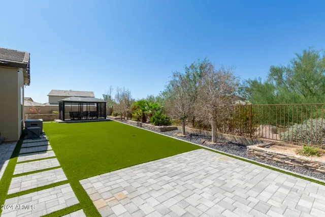 a view of a patio with a table and chairs