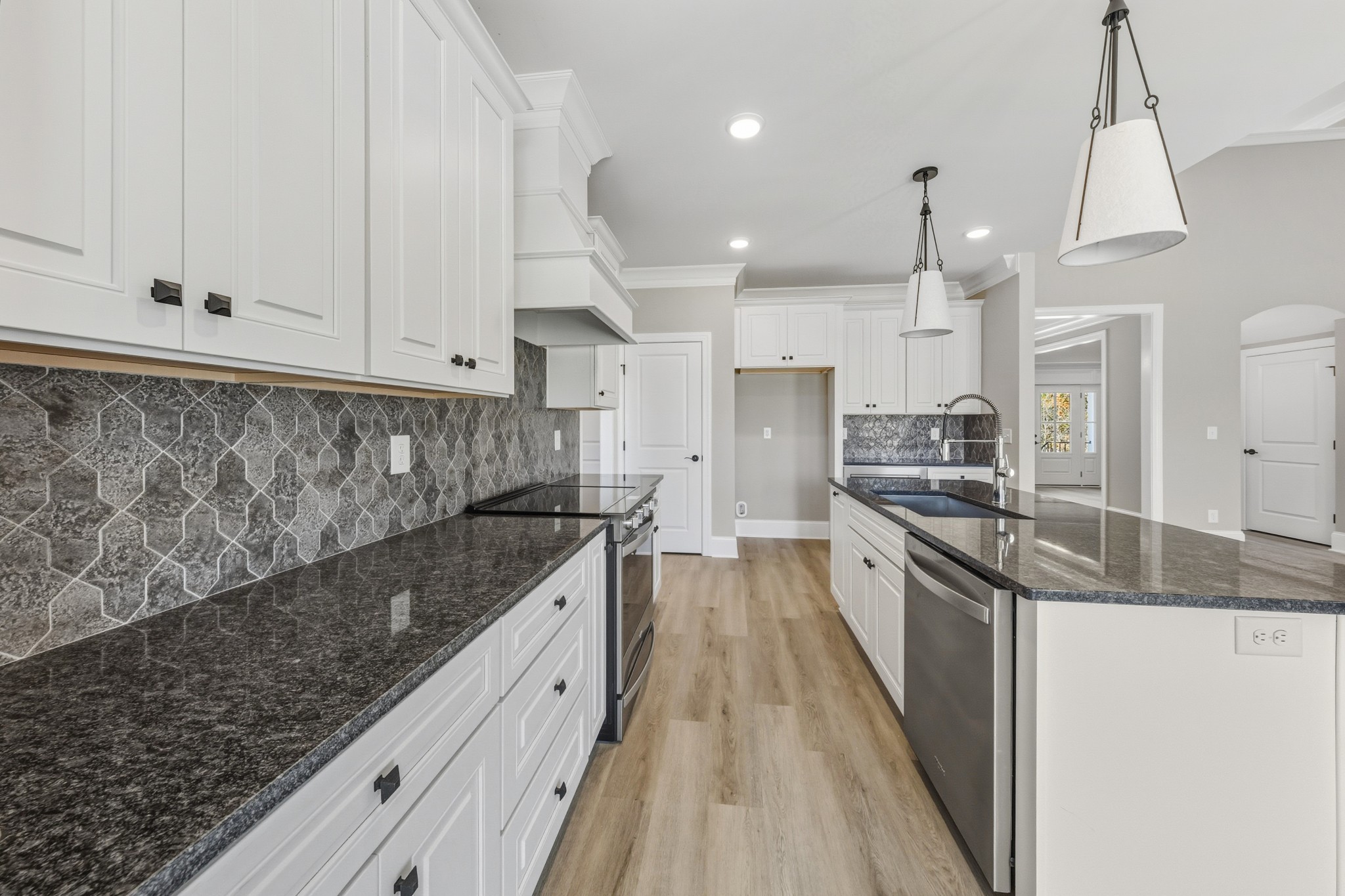 1675 Sulphur College Road Hartsville, TN 37074 - Photo 11 of 42 a large kitchen with granite countertop a lot of counter space and wooden floor
