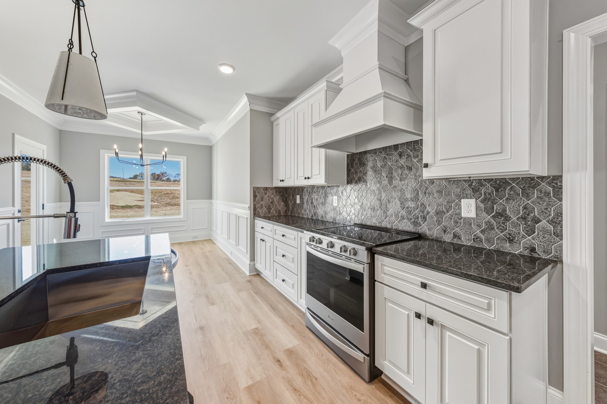 1675 Sulphur College Road Hartsville, TN 37074 - Photo 14 of 42 a kitchen with stainless steel appliances granite countertop a stove and a sink