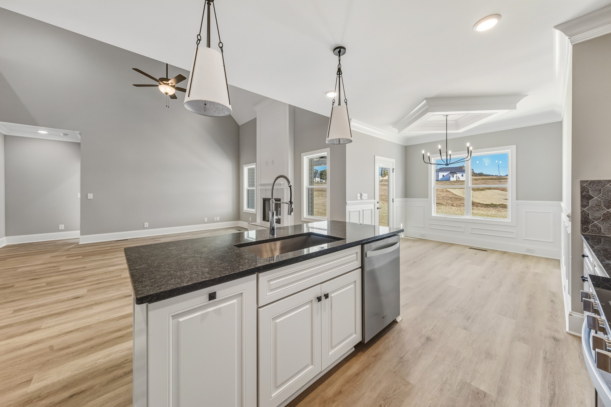 1675 Sulphur College Road Hartsville, TN 37074 - Photo 15 of 42 a kitchen with granite countertop a sink a toilet and cabinets