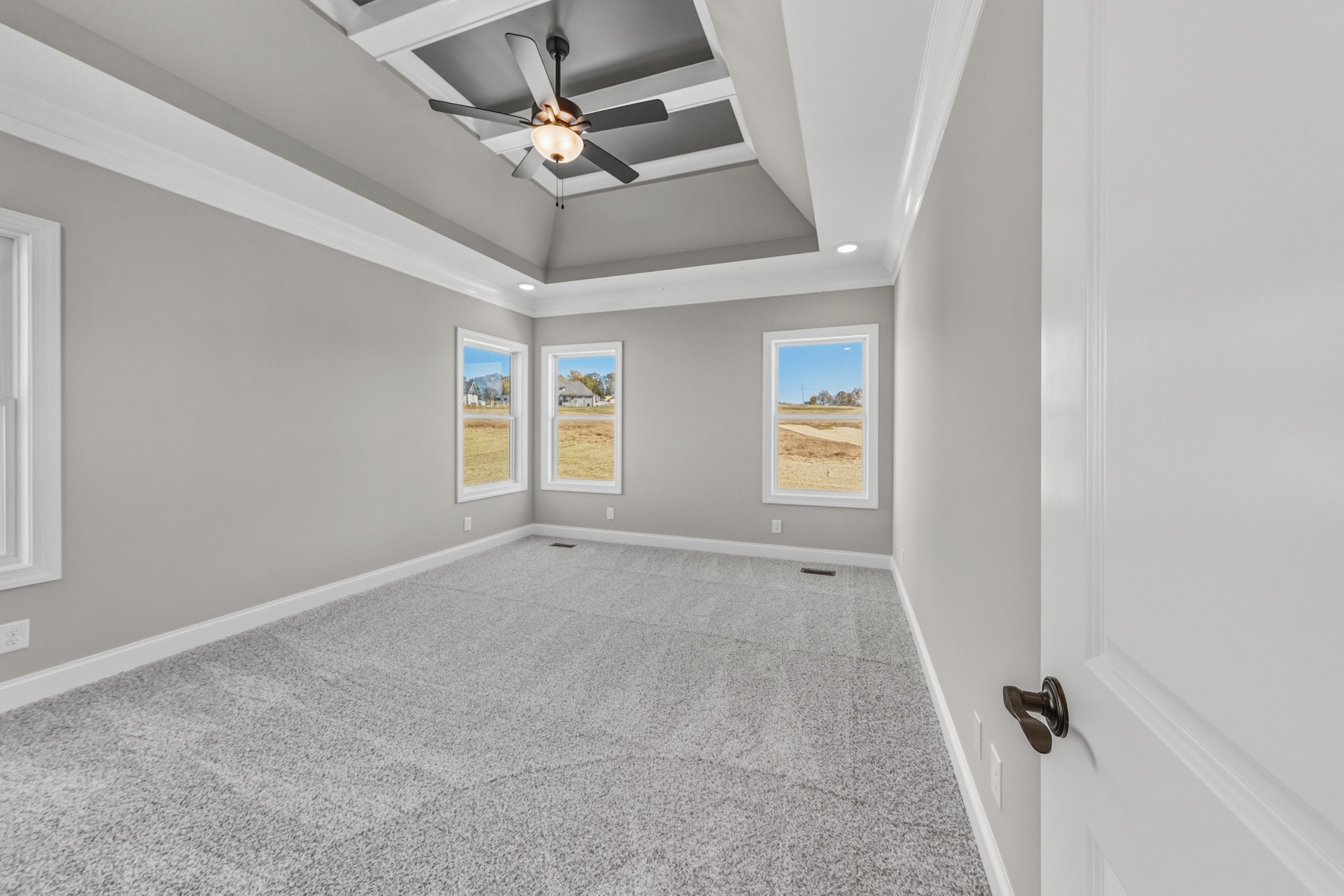 1675 Sulphur College Road Hartsville, TN 37074 - Photo 16 of 42 an empty room with windows and fan