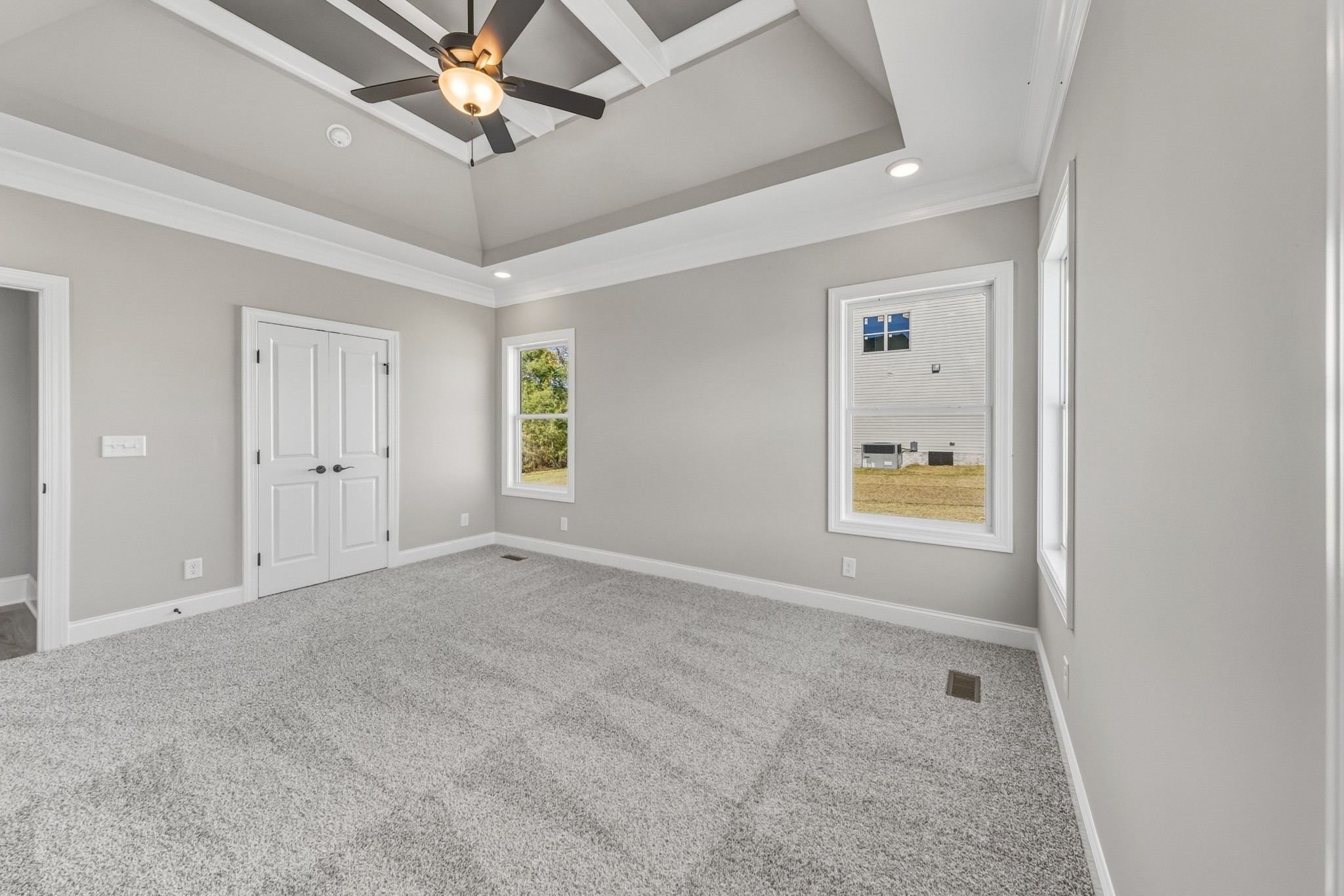 1675 Sulphur College Road Hartsville, TN 37074 - Photo 17 of 42 an empty room with windows and fan