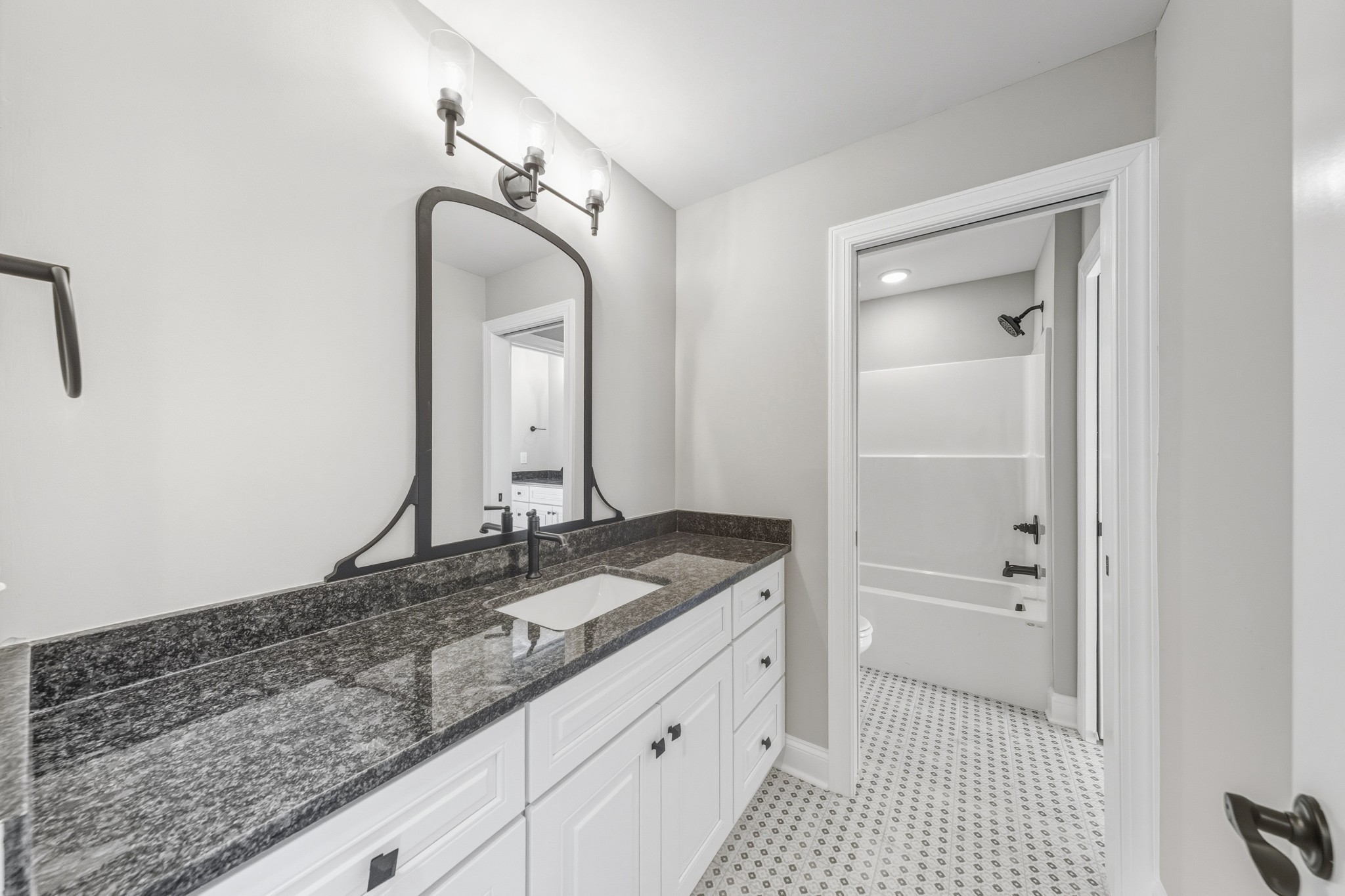 1675 Sulphur College Road Hartsville, TN 37074 - Photo 32 of 42 a bathroom with a granite countertop sink and a mirror