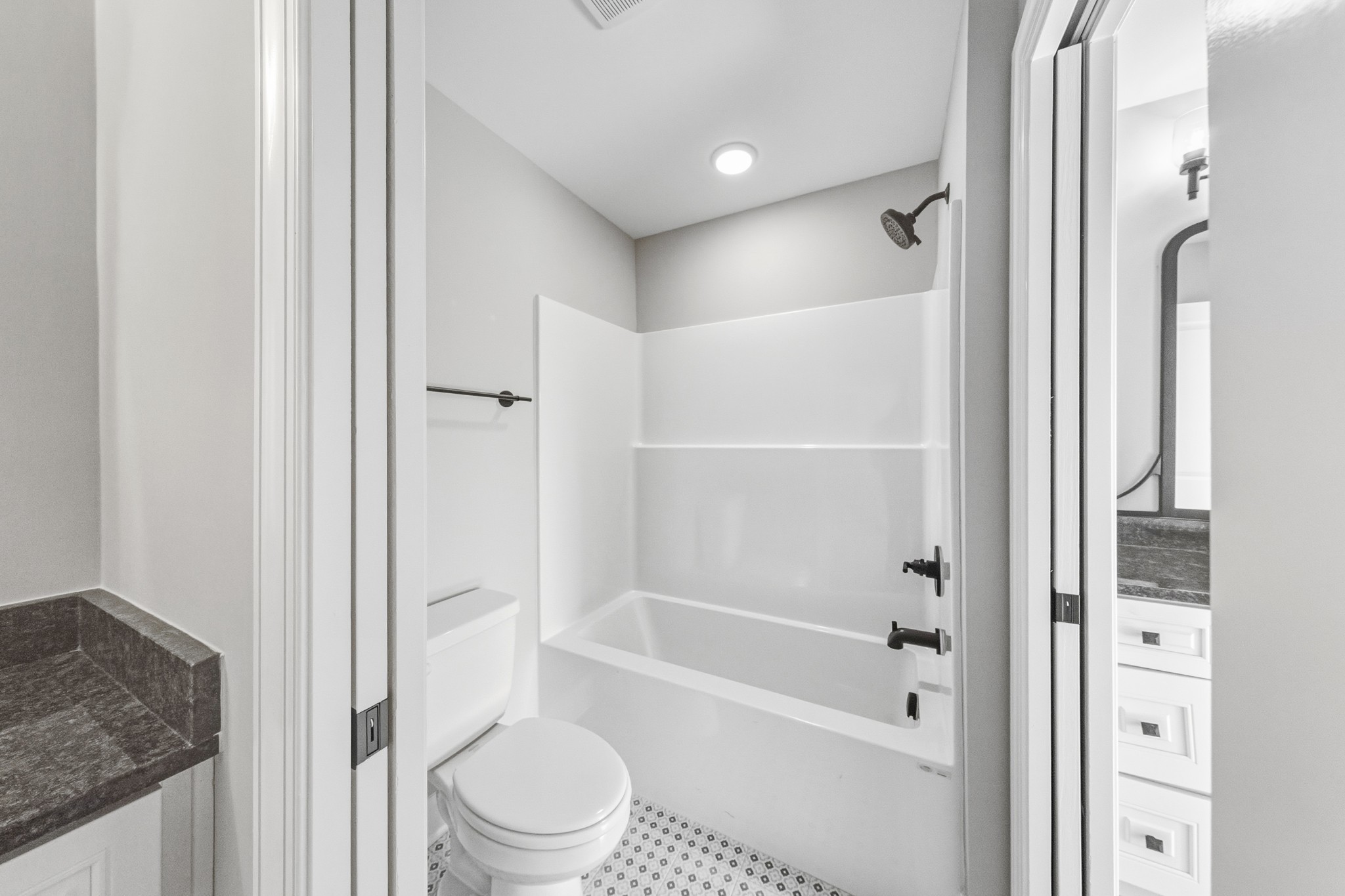 1675 Sulphur College Road Hartsville, TN 37074 - Photo 33 of 42 a bathroom with a granite countertop tub sink and toilet